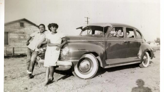 Ricardo "Papu" Ovilla, left, and the family's first car. Ovilla is pictured with his children Martha (next to him) and Aurelia and Rodolfo Sandoval (left to right, inside the car) in a photo taken in 1949 at a labor camp in Escondido, Calif. Ricardo "Papu" Ovilla, left, and the family's first car. Ovilla is pictured with his children Martha (next to him) and Aurelia and Rodolfo Sandoval (left to right, inside the car) in a photo taken in 1949 at a labor camp in Escondido, Calif.