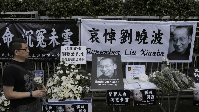A man mourns late Chinese Nobel Peace laureate Liu Xiaobo outside the Chinese liaison office in Hong Kong. A man mourns late Chinese Nobel Peace laureate Liu Xiaobo outside the Chinese liaison office in Hong Kong.