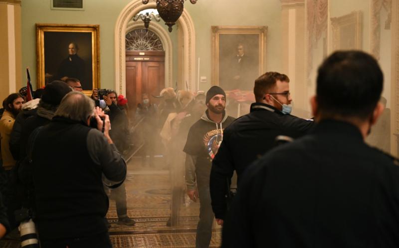 Supporters of President Trump stormed the U.S. Capitol on Jan. 6. Democratic Rep. Tim Ryan of Ohio says investigators are looking at "potentially members of Congress" who gave tours to rioters prior to the insurrection. Supporters of President Trump stormed the U.S. Capitol on Jan. 6. Democratic Rep. Tim Ryan of Ohio says investigators are looking at "potentially members of Congress" who gave tours to rioters prior to the insurrection.