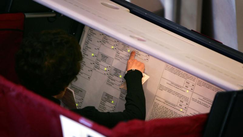 A voter fills out her ballot in Las Vegas in 2004. A new report finds several states, including Nevada, have voting machines more than 10 years old, which are more likely to fail. A voter fills out her ballot in Las Vegas in 2004. A new report finds several states, including Nevada, have voting machines more than 10 years old, which are more likely to fail.