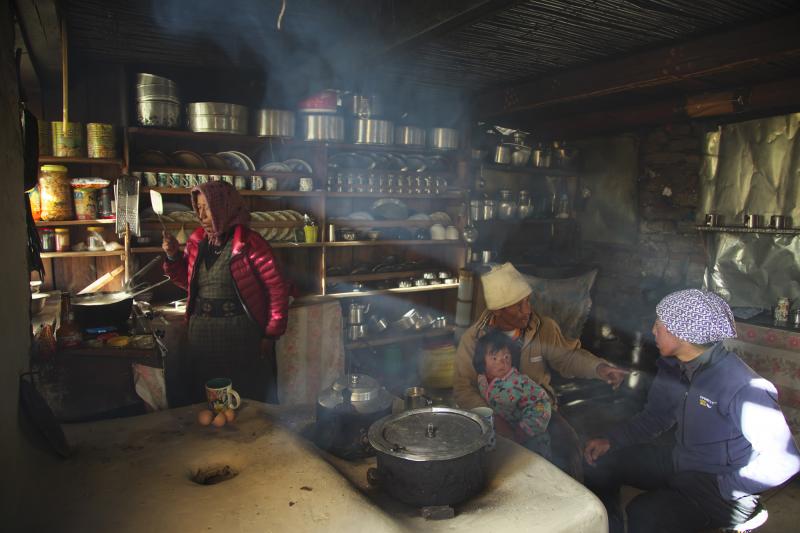 A family in Nepal prepares a meal. The use of organic fuels like wood or animal dung for cooking contributes to indoor air pollution. A family in Nepal prepares a meal. The use of organic fuels like wood or animal dung for cooking contributes to indoor air pollution.