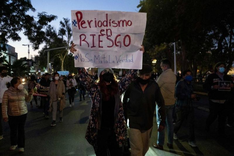 Journalists and supporters hold signs as they protest the murders of their colleagues Lourdes Maldonado and Margarito Martinez in Tijuana, Baja California, Mexico. The sign says, "Journalism at risk. Don't kill the truth." Journalists and supporters hold signs as they protest the murders of their colleagues Lourdes Maldonado and Margarito Martinez in Tijuana, Baja California, Mexico. The sign says, "Journalism at risk. Don't kill the truth."