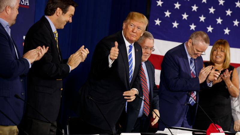 At an event in West Virginia this month, President Trump was seated between Rep. Evan Jenkins (to his right) and state Attorney General Patrick Morrisey, both of whom are running for the Senate. At an event in West Virginia this month, President Trump was seated between Rep. Evan Jenkins (to his right) and state Attorney General Patrick Morrisey, both of whom are running for the Senate.