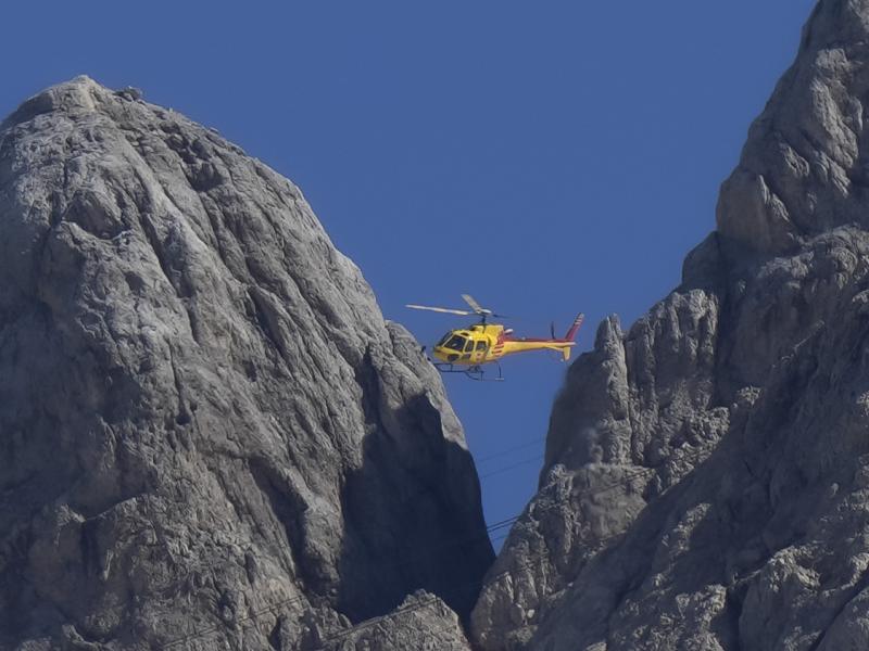 A rescue helicopter hovers over the Punta Rocca glacier near Canazei, in the Italian Alps in northern Italy, Monday, July 4, 2022. A rescue helicopter hovers over the Punta Rocca glacier near Canazei, in the Italian Alps in northern Italy, Monday, July 4, 2022.