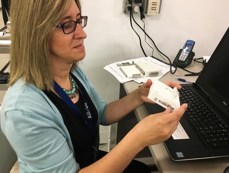 Mine Cicek, an assistant professor at the Mayo Clinic, processes samples for the All of Us program. Mine Cicek, an assistant professor at the Mayo Clinic, processes samples for the All of Us program.