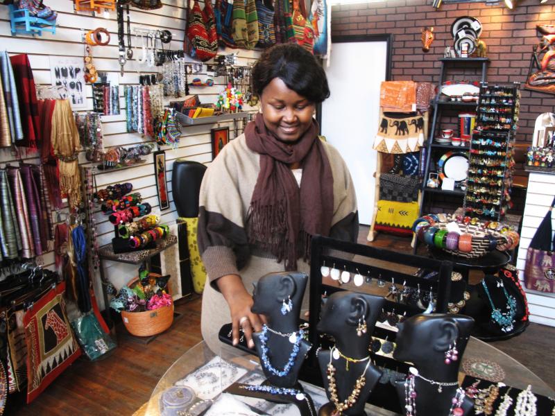 Louise Sano sells jewelry, clothing and gifts at her boutique, Global Villages, on Buffalo's west side. "It's very easy to integrate as a new American, a new person coming to the U.S. So I feel like I have created my own village," she says. Louise Sano sells jewelry, clothing and gifts at her boutique, Global Villages, on Buffalo's west side. "It's very easy to integrate as a new American, a new person coming to the U.S. So I feel like I have created my own village," she says.