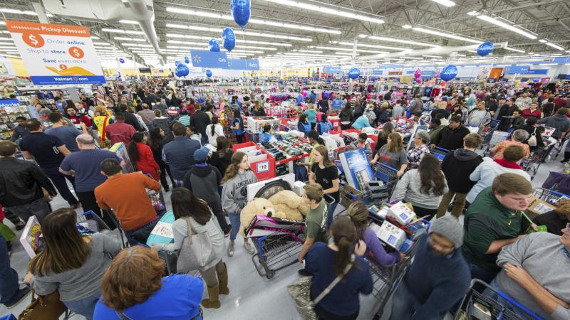 Shoppers fill a Walmart on Thanksgiving day in Bentonville, Ark. Sales in November were up from last year. Shoppers fill a Walmart on Thanksgiving day in Bentonville, Ark. Sales in November were up from last year.
