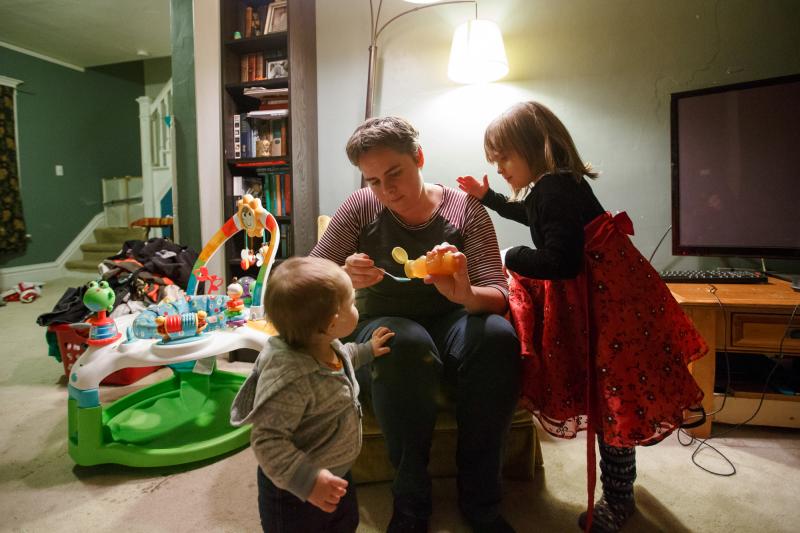 Four-year-old Violet (right) supervises as her mom Margaret Siebers pours a first-ever spoonful of honey for 1-year-old Frances to try. Siebers spent much of the end of her pregnancy with Frances confined to bed rest at her home in Milwaukee. Four-year-old Violet (right) supervises as her mom Margaret Siebers pours a first-ever spoonful of honey for 1-year-old Frances to try. Siebers spent much of the end of her pregnancy with Frances confined to bed rest at her home in Milwaukee.