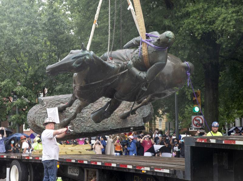 A Stonewall Jackson statue is loaded on a truck after being removed from Monument Avenue in Richmond, Va., on Wednesday. A Stonewall Jackson statue is loaded on a truck after being removed from Monument Avenue in Richmond, Va., on Wednesday.