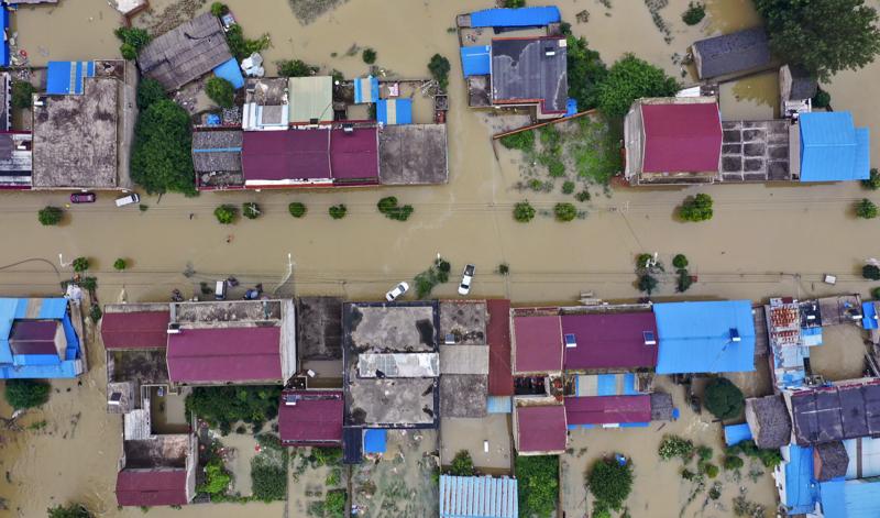An aerial photo shows the extent of flooding in Guzhen Town of Lu'an City in eastern China's Anhui province on July 20. An aerial photo shows the extent of flooding in Guzhen Town of Lu'an City in eastern China's Anhui province on July 20.