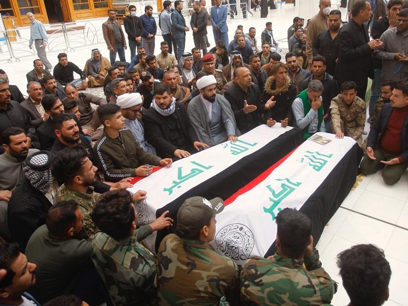 Mourners pray over the flag-draped coffins of two Popular Mobilization Forces fighters killed in the Thursday U.S. airstrike in Iraq, during their funeral procession at the Imam Ali shrine in Najaf, Iraq, Saturday. Mourners pray over the flag-draped coffins of two Popular Mobilization Forces fighters killed in the Thursday U.S. airstrike in Iraq, during their funeral procession at the Imam Ali shrine in Najaf, Iraq, Saturday.