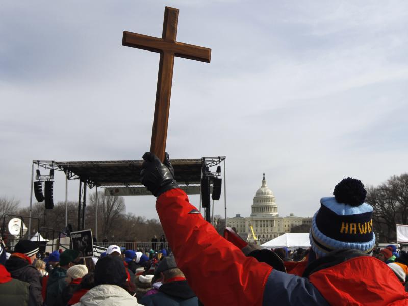 A man holds a cross during an anti-abortion rally on the National Mall in Washington on Jan. 24, 2011. A man holds a cross during an anti-abortion rally on the National Mall in Washington on Jan. 24, 2011.