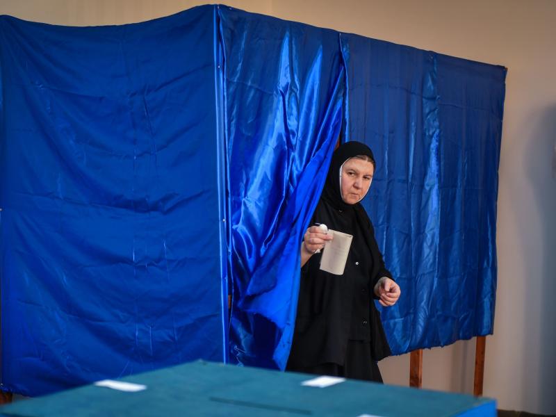 A Romanian Christian-Orthodox nun votes at a polling station in the village of Branesti, Romania, in a referendum to change the constitutional definition of "family", on October 6, 2018. A Romanian Christian-Orthodox nun votes at a polling station in the village of Branesti, Romania, in a referendum to change the constitutional definition of "family", on October 6, 2018.