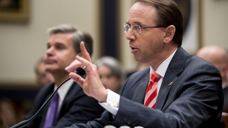 Deputy Attorney General Rod Rosenstein told lawmakers Thursday that he objected to personal attacks about purported Justice Department stonewalling on the Russia investigation. With him is FBI Director Christopher Wray. Deputy Attorney General Rod Rosenstein told lawmakers Thursday that he objected to personal attacks about purported Justice Department stonewalling on the Russia investigation. With him is FBI Director Christopher Wray.
