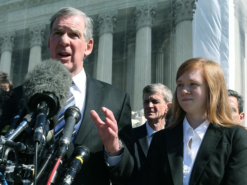 Attorney Bert Rein speaks to the media while standing with plaintiff Abigail Noel Fisher after the U.S. Supreme Court heard arguments in her case in 2012 in Washington, D.C. Attorney Bert Rein speaks to the media while standing with plaintiff Abigail Noel Fisher after the U.S. Supreme Court heard arguments in her case in 2012 in Washington, D.C.