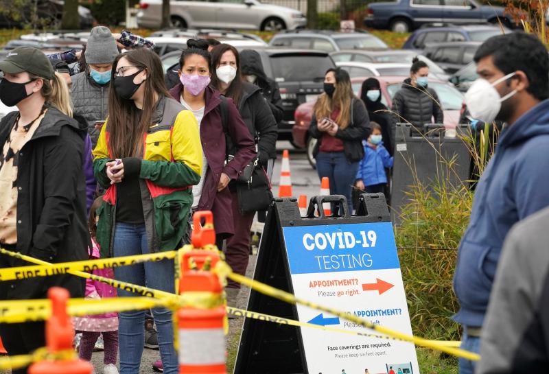 People line up to be tested for the coronavirus at a free testing site Wednesday, Nov. 18 in Seattle. People line up to be tested for the coronavirus at a free testing site Wednesday, Nov. 18 in Seattle.