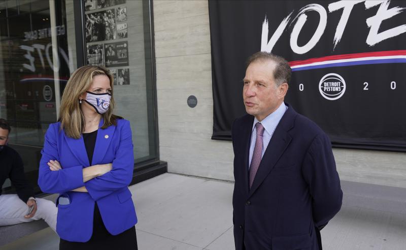Michigan Secretary of State Jocelyn Benson (left) and Detroit Pistons Vice Chairman Arn Tellem talk about voting last Thursday, when balloting began in the state. The Pistons are allowing their arena to be used as a polling station. Michigan Secretary of State Jocelyn Benson (left) and Detroit Pistons Vice Chairman Arn Tellem talk about voting last Thursday, when balloting began in the state. The Pistons are allowing their arena to be used as a polling station.