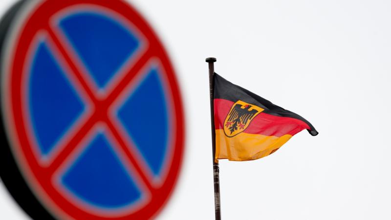 The German flag is seen outside the Embassy in Moscow, where Russia's Foreign Ministry announced Thursday the expulsion of two German diplomats. The German flag is seen outside the Embassy in Moscow, where Russia's Foreign Ministry announced Thursday the expulsion of two German diplomats.