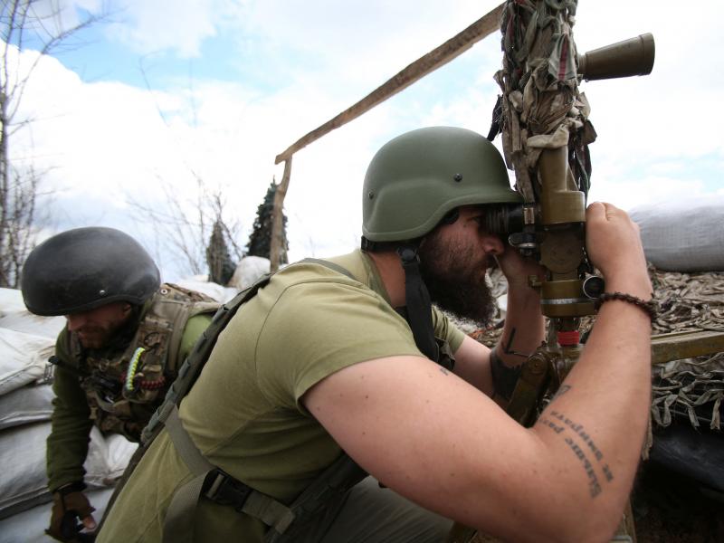 A Ukrainian serviceman looks through a periscope at his position on the fronline against Russia-backed separatists, not far from Donetsk, Ukraine, on Thursday. A Ukrainian serviceman looks through a periscope at his position on the fronline against Russia-backed separatists, not far from Donetsk, Ukraine, on Thursday.