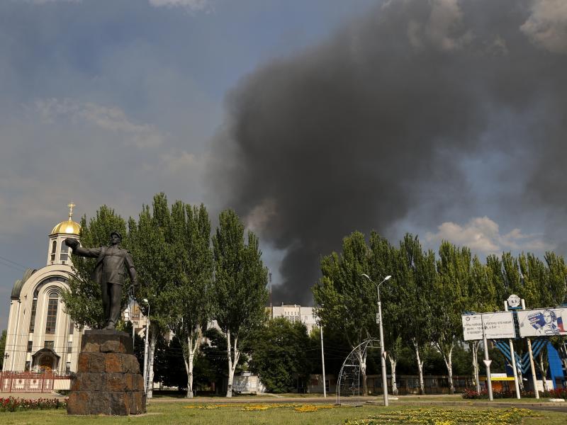 Smoke rises from a burning house following shelling in Donetsk, eastern Ukraine, on Friday. Smoke rises from a burning house following shelling in Donetsk, eastern Ukraine, on Friday.