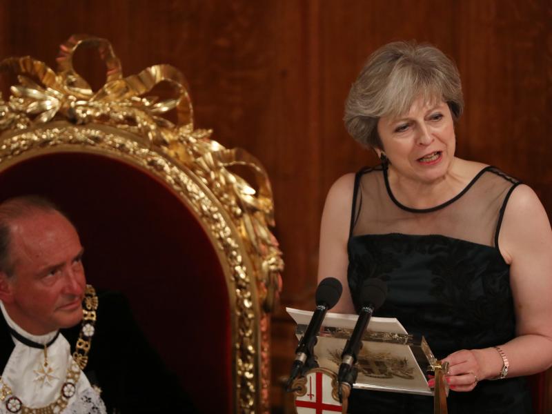 U.K. Prime Minister Theresa May speaks as Charles Bowman, Lord Mayor of the City of London, listens during the annual Lord Mayor's Banquet at the Guildhall, in the square mile financial district of the City of London on Monday. U.K. Prime Minister Theresa May speaks as Charles Bowman, Lord Mayor of the City of London, listens during the annual Lord Mayor's Banquet at the Guildhall, in the square mile financial district of the City of London on Monday.