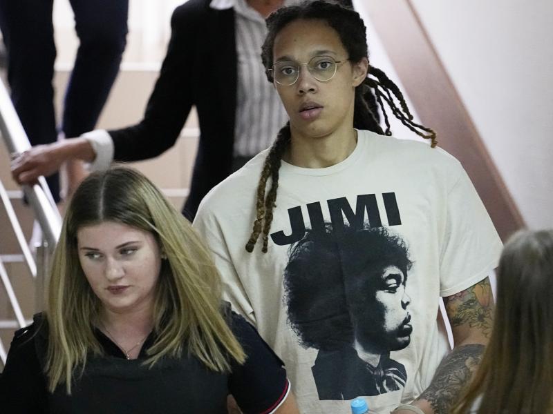 WNBA star and two-time Olympic gold medalist Brittney Griner is escorted to a courtroom for a hearing in Khimki just outside Moscow, as her trial begins on Friday. WNBA star and two-time Olympic gold medalist Brittney Griner is escorted to a courtroom for a hearing in Khimki just outside Moscow, as her trial begins on Friday.