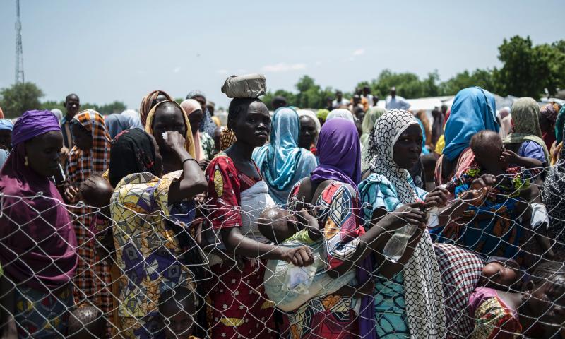 Women and children line up for food in one of the camps for displaced persons in Nigeria. The photo was taken on September 15, 2016. Women and children line up for food in one of the camps for displaced persons in Nigeria. The photo was taken on September 15, 2016.