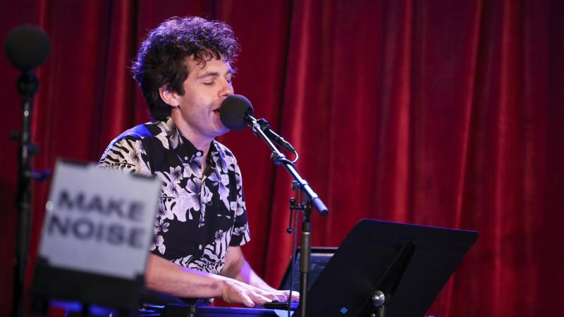 Ask Me Another's guest house musician Julian Velard leads a music parody game at the Bell House in Brooklyn, New York. Ask Me Another's guest house musician Julian Velard leads a music parody game at the Bell House in Brooklyn, New York.