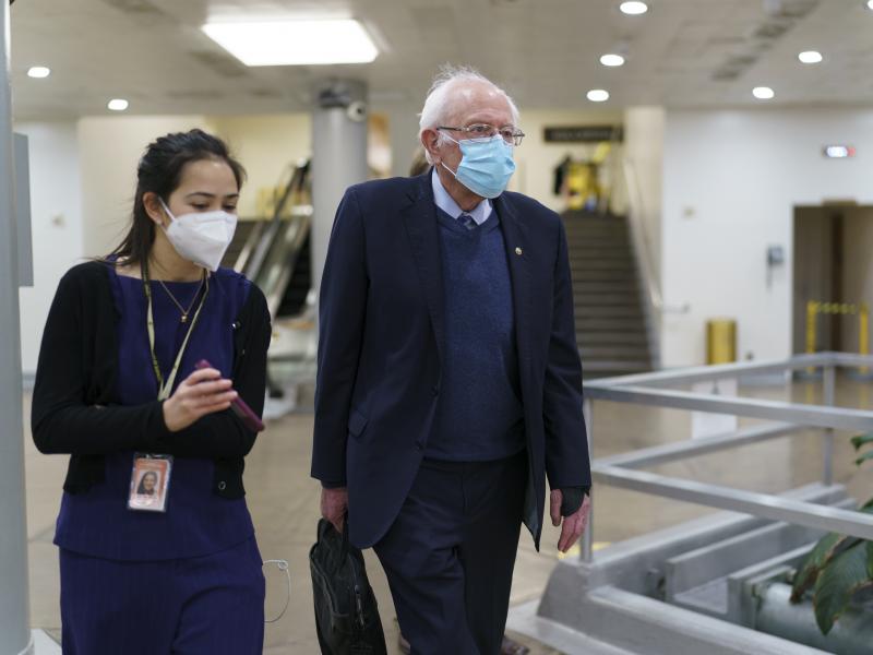 Sen. Bernie Sanders returns to his office on March 5, 2021, while the Senate works on the Democrats' $1.9 trillion COVID-19 relief bill. Sanders calls the recently passed package "the most consequential" for working families in decades. Sen. Bernie Sanders returns to his office on March 5, 2021, while the Senate works on the Democrats' $1.9 trillion COVID-19 relief bill. Sanders calls the recently passed package "the most consequential" for working families in decades.