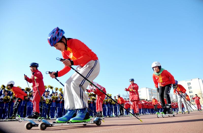 Students from the Youth Winter Olympic Sports School perform ice and snow gymnastics during an event marking the 100-day countdown to the 2022 Winter Olympic Games in Zhangjiakou, Hebei province, China, on Tuesday. Students from the Youth Winter Olympic Sports School perform ice and snow gymnastics during an event marking the 100-day countdown to the 2022 Winter Olympic Games in Zhangjiakou, Hebei province, China, on Tuesday.