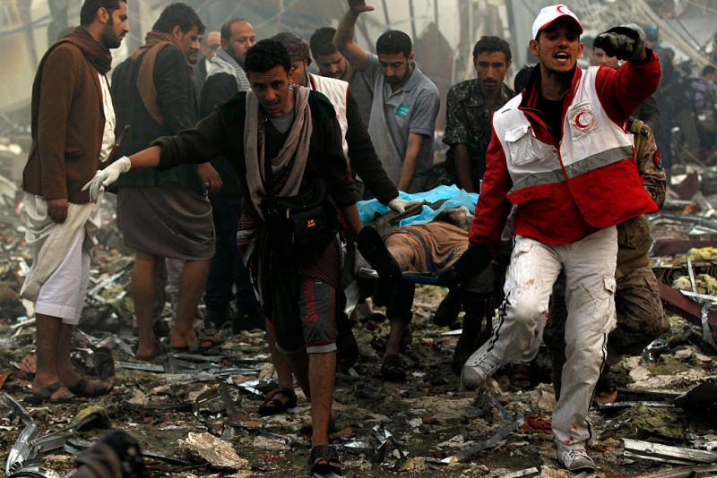 Yemeni rescue workers carry a victim on a stretcher amid the rubble of a destroyed funeral hall building following airstrikes by Saudi-led coalition planes on the capital Sanaa last Saturday. Yemeni rescue workers carry a victim on a stretcher amid the rubble of a destroyed funeral hall building following airstrikes by Saudi-led coalition planes on the capital Sanaa last Saturday.