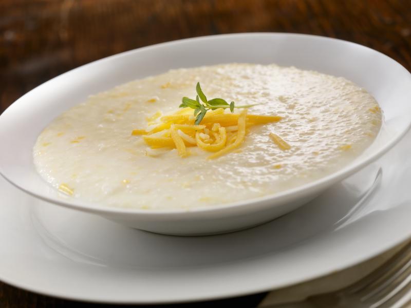 A bowl of creamy cheese grits. Food writer Erin Byers Murray hopes that exploring the story of grits will help spur more discussion about how food shapes our culture, as humble ingredients are elevated into expensive dishes even as we come to terms with l A bowl of creamy cheese grits. Food writer Erin Byers Murray hopes that exploring the story of grits will help spur more discussion about how food shapes our culture, as humble ingredients are elevated into expensive dishes even as we come to terms with l