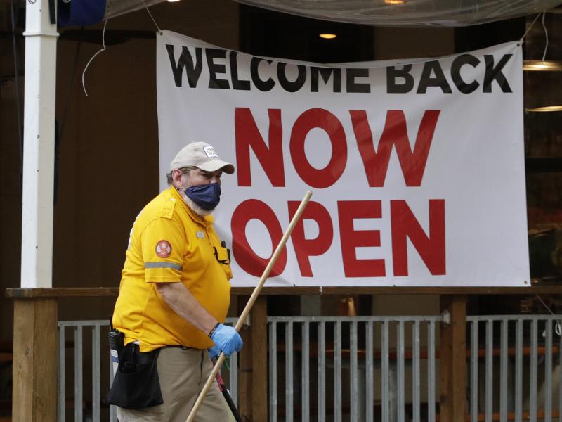 A worker passes a sign at a restaurant along San Antonio's River Walk that has reopened. As businesses reopen around the U.S., many workers are worried for their health. A worker passes a sign at a restaurant along San Antonio's River Walk that has reopened. As businesses reopen around the U.S., many workers are worried for their health.