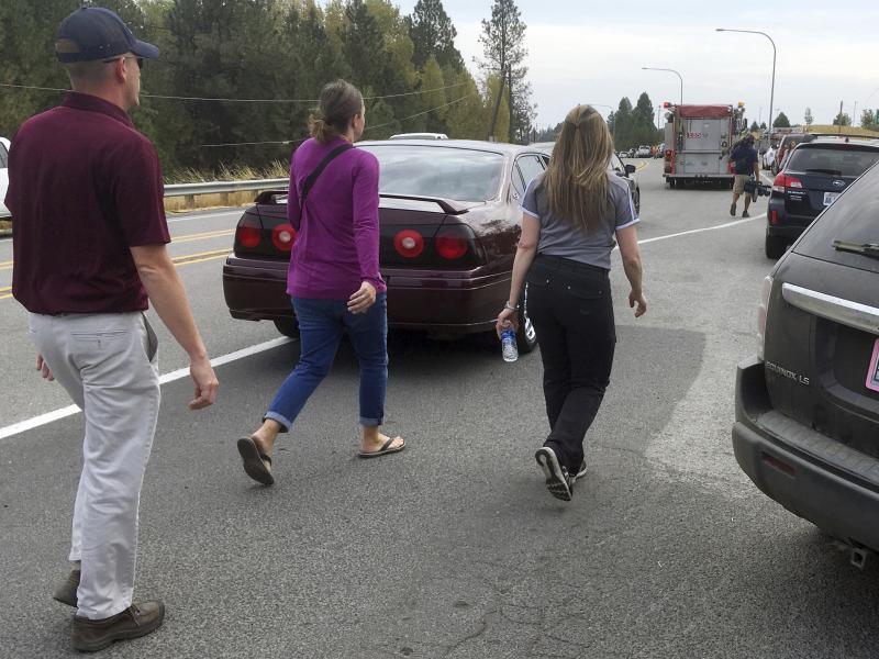 People hurry toward Freeman High School in Rockford, Wash., following a deadly shooting there. People hurry toward Freeman High School in Rockford, Wash., following a deadly shooting there.