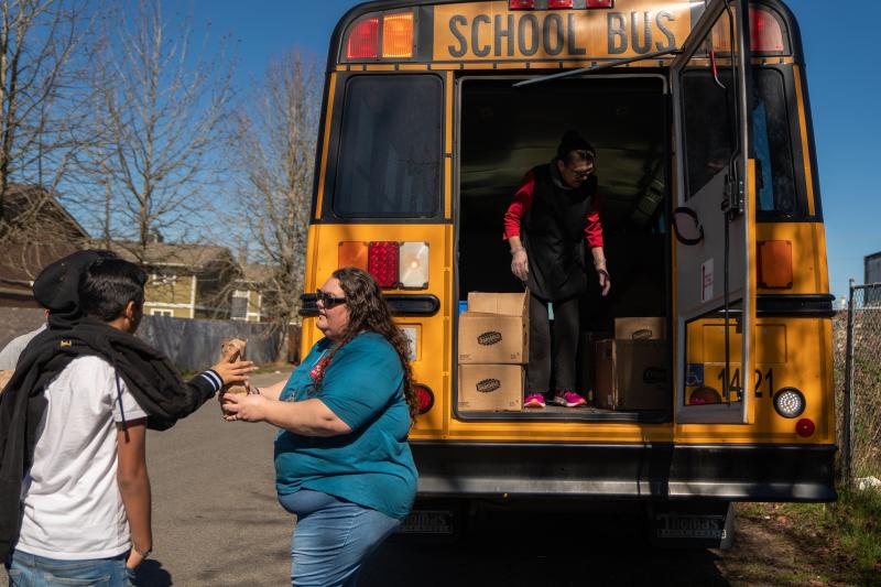 Franklin Pierce Schools bus driver Margie Huggler hands out free meals to students in Tacoma, Wash. Franklin Pierce Schools bus driver Margie Huggler hands out free meals to students in Tacoma, Wash.
