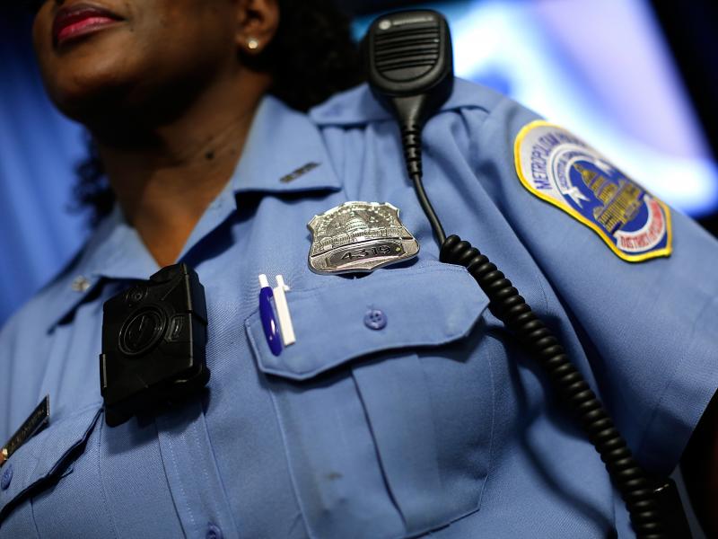 A Washington, D.C., Metropolitan Police officer wears a camera during a news conference in 2014. A Washington, D.C., Metropolitan Police officer wears a camera during a news conference in 2014.