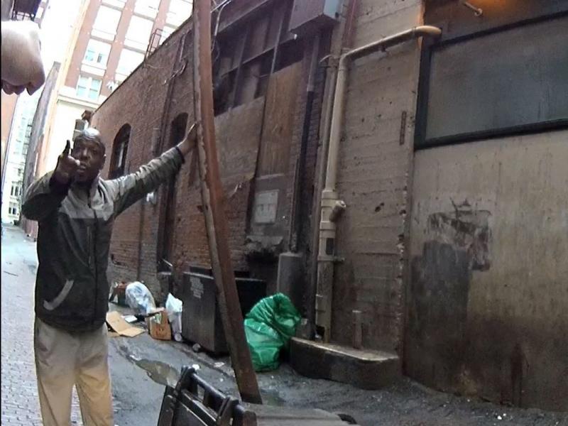 Seattle Police body camera image of a mentally ill man who claimed a downtown alleyway and was chasing people away with a length of drain pipe. Seattle Police body camera image of a mentally ill man who claimed a downtown alleyway and was chasing people away with a length of drain pipe.