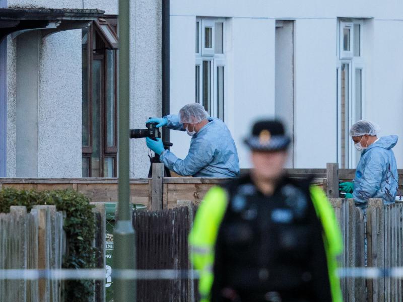 Forensics officers investigate a property in relation to Friday's terror attack in London. The threat level in the United Kingdom was raised to "critical" after the attack, but it was lowered to "severe" on Sunday. Forensics officers investigate a property in relation to Friday's terror attack in London. The threat level in the United Kingdom was raised to "critical" after the attack, but it was lowered to "severe" on Sunday.