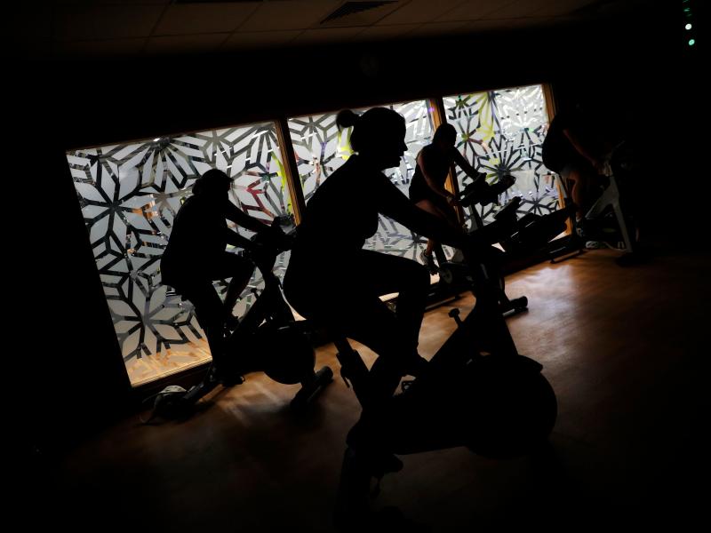 People are working out in the shadows. People are working out in the shadows.