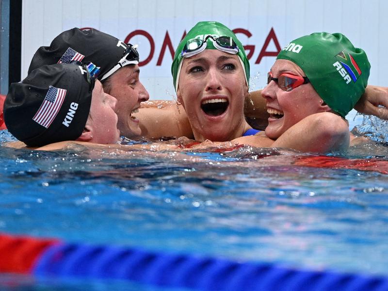 South Africa's Tatjana Schoenmaker, second from right, cheers with teammate Kaylene Corbett, right, and medalists Annie Lazor and Lilly King of Team USA after winning the final of the women's 200m breaststroke swimming event at the Tokyo Aquatics Centre o South Africa's Tatjana Schoenmaker, second from right, cheers with teammate Kaylene Corbett, right, and medalists Annie Lazor and Lilly King of Team USA after winning the final of the women's 200m breaststroke swimming event at the Tokyo Aquatics Centre o