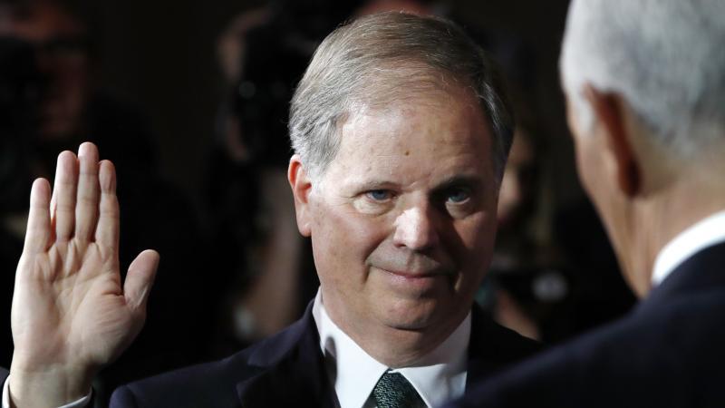Sen. Doug Jones, D-Ala., listens as Vice President Pence administers the Senate oath of office during a mock swearing in ceremony in January. Sen. Doug Jones, D-Ala., listens as Vice President Pence administers the Senate oath of office during a mock swearing in ceremony in January.