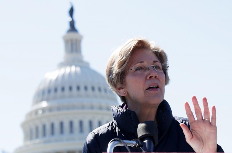 Sen. Elizabeth Warren, D-Mass., speaks during a rally in front of the Capitol on March 22. She writes about the middle class and activism in her new book, This Fight Is Our Fight. Sen. Elizabeth Warren, D-Mass., speaks during a rally in front of the Capitol on March 22. She writes about the middle class and activism in her new book, This Fight Is Our Fight.