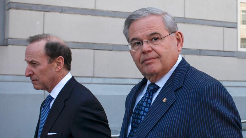 U.S. Sen. Robert Menendez, D-N.J., (right) speaks alongside his lawyer, Abbe Lowell, after being indicted on corruption charges in April. U.S. Sen. Robert Menendez, D-N.J., (right) speaks alongside his lawyer, Abbe Lowell, after being indicted on corruption charges in April.