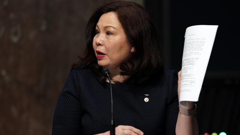 Sen. Tammy Duckworth, D-Ill., at a Senate Armed Services Committee hearing in May. She wants an Army officer who testified at Trump impeachment hearings to get his promotion. Sen. Tammy Duckworth, D-Ill., at a Senate Armed Services Committee hearing in May. She wants an Army officer who testified at Trump impeachment hearings to get his promotion.