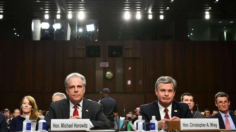 Justice Department Inspector General Michael Horowitz and FBI Director Christopher Wray wait to testify before the Senate Judiciary Committee on Monday. Justice Department Inspector General Michael Horowitz and FBI Director Christopher Wray wait to testify before the Senate Judiciary Committee on Monday.