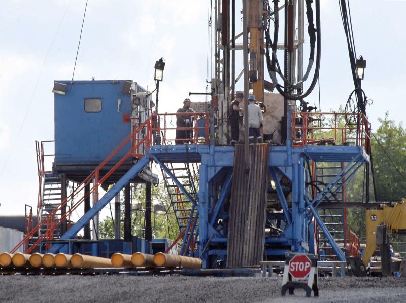 A crew works on a drilling rig at a well site for shale-based natural gas in Zelienople, Pa., in 2012. A crew works on a drilling rig at a well site for shale-based natural gas in Zelienople, Pa., in 2012.