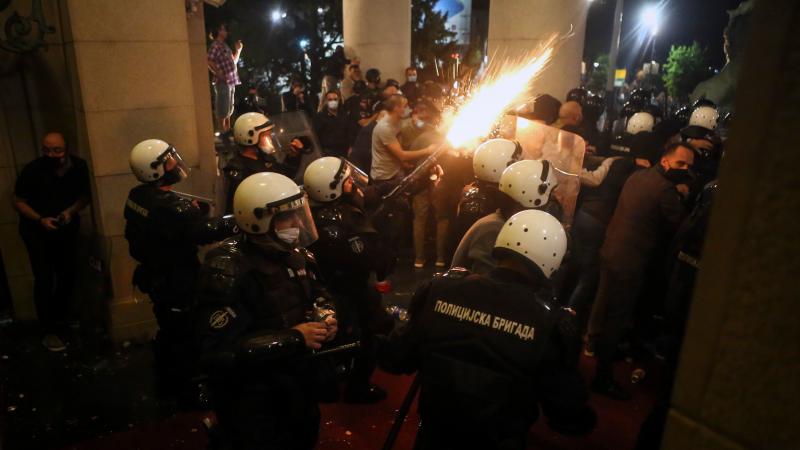 Protesters clash with police Tuesday night in front of the National Assembly building in Belgrade, Serbia. Protesters clash with police Tuesday night in front of the National Assembly building in Belgrade, Serbia.