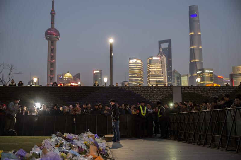 On Jan. 1, people gathered at a makeshift memorial marking the site of a New Year's Eve stampede on the Bund in Shanghai, China. Three dozen people died, and dozens more were injured. On Jan. 1, people gathered at a makeshift memorial marking the site of a New Year's Eve stampede on the Bund in Shanghai, China. Three dozen people died, and dozens more were injured.