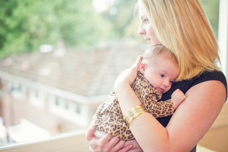 Lisa Abramson holds her firstborn child, Lucy, in 2014. A few weeks after Lucy's birth, Abramson began feeling confused and then started developing delusions — symptoms of postpartum psychosis. Lisa Abramson holds her firstborn child, Lucy, in 2014. A few weeks after Lucy's birth, Abramson began feeling confused and then started developing delusions — symptoms of postpartum psychosis.