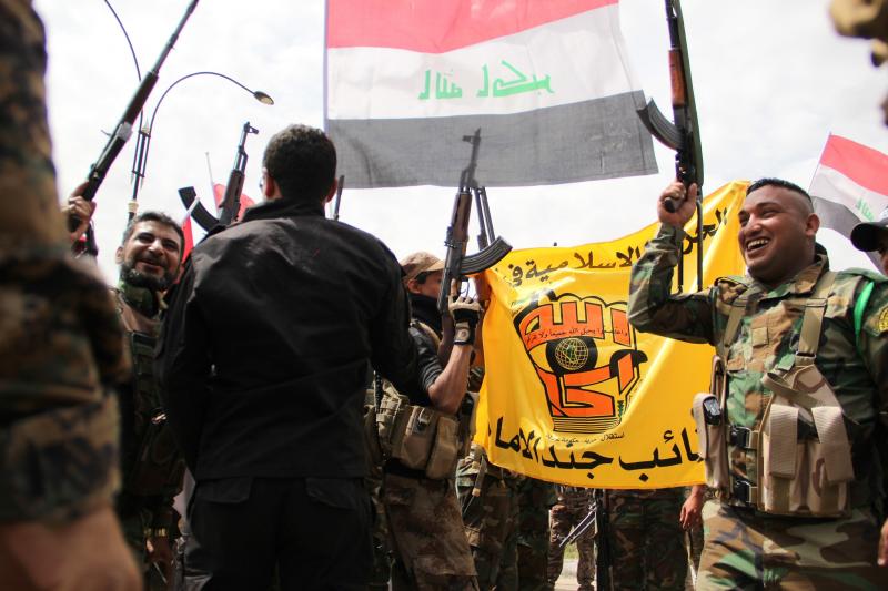 Iraqi forces, including soldiers, police officers and militiamen, celebrate after retaking the city of Tikrit on Wednesday. Most of the Iraqi forces are Shiite Muslims, while Tikrit's residents are overwhelmingly Sunni Muslims. Iraqi forces, including soldiers, police officers and militiamen, celebrate after retaking the city of Tikrit on Wednesday. Most of the Iraqi forces are Shiite Muslims, while Tikrit's residents are overwhelmingly Sunni Muslims.